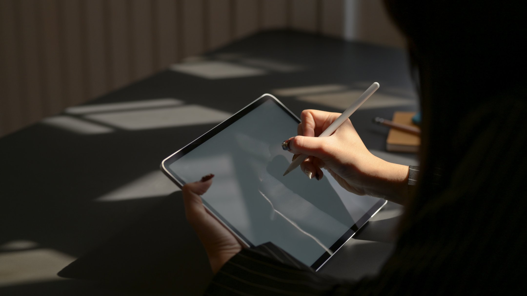 Person Holding White Ipad With White Case